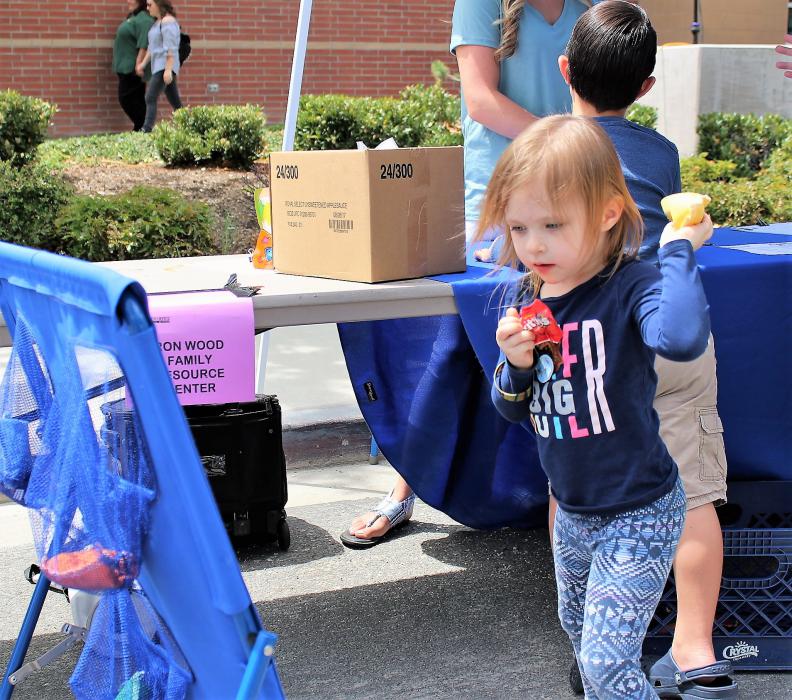A girl tosses a bean into the net Saturday at the Carson City Sheriff's Office.