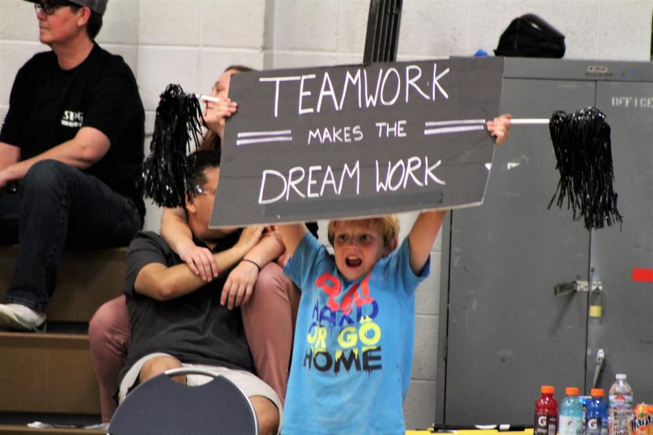 A young fan cheers on his hometown team.