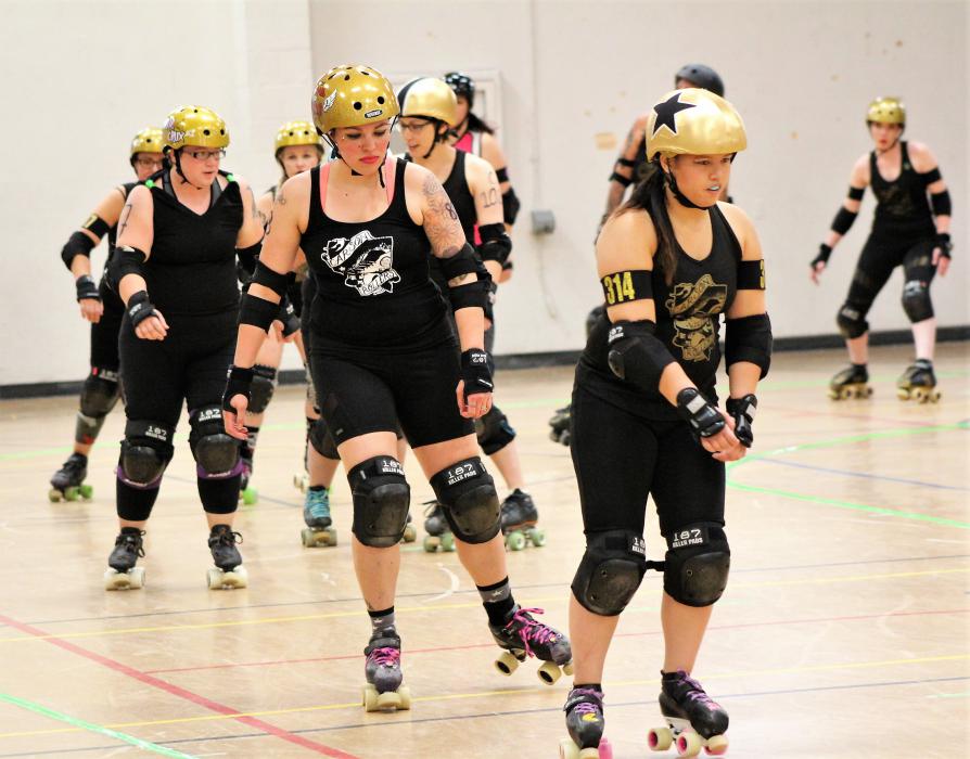 Carson Victory Rollers skaters warm up before their bout.