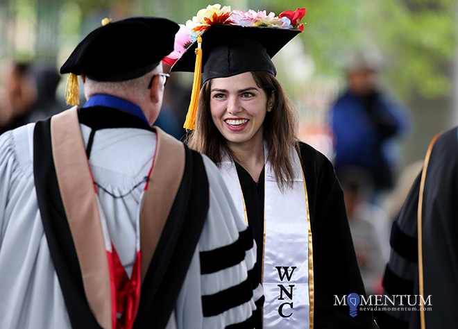 Tania Covarrubias receives her diploma during the 2018 Western Nevada College Commencement ceremony on Monday in Carson City.