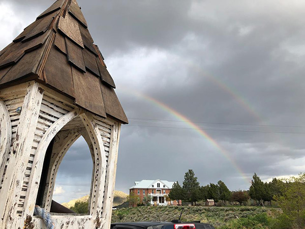 A rainbow greets the Upside Down Church as it arrives in Virginia City.