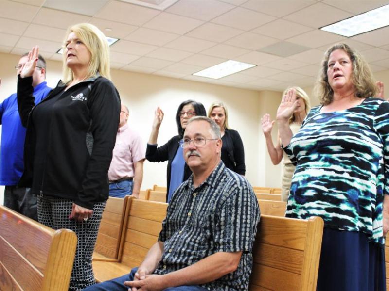 Photos by Brett Fisher. CASA guardians ad litem stand to take the oath Wednesday in Carson City.