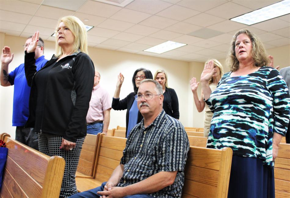 Photos by Brett Fisher. CASA guardians ad litem stand to take the oath Wednesday in Carson City.