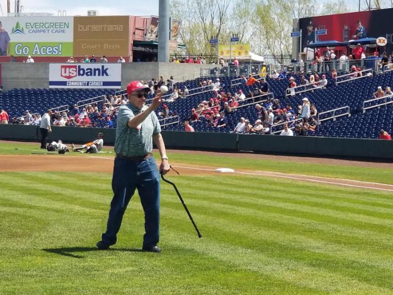 Summit Estates Senior Living resident Marvin Dockter throws the first pitch.