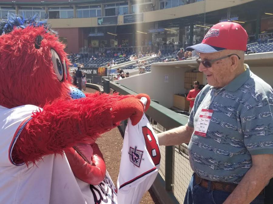 The Reno Aces’ mascot, Archie, presents Marvin Dockter with a personalized Reno Aces jersey.