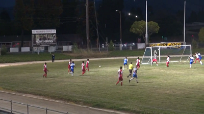 Nick Tunic (blue) watches is shot fly over the head of the Real San Jose goalkeeper