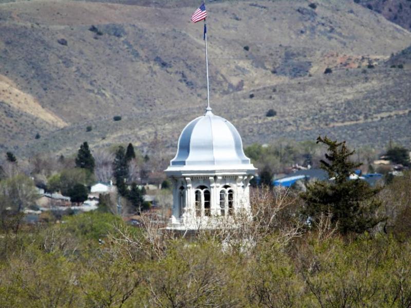 Photo by Brett Fisher. The silver dome of the Nevada Capitol rises above Carson City's high desert landscape.