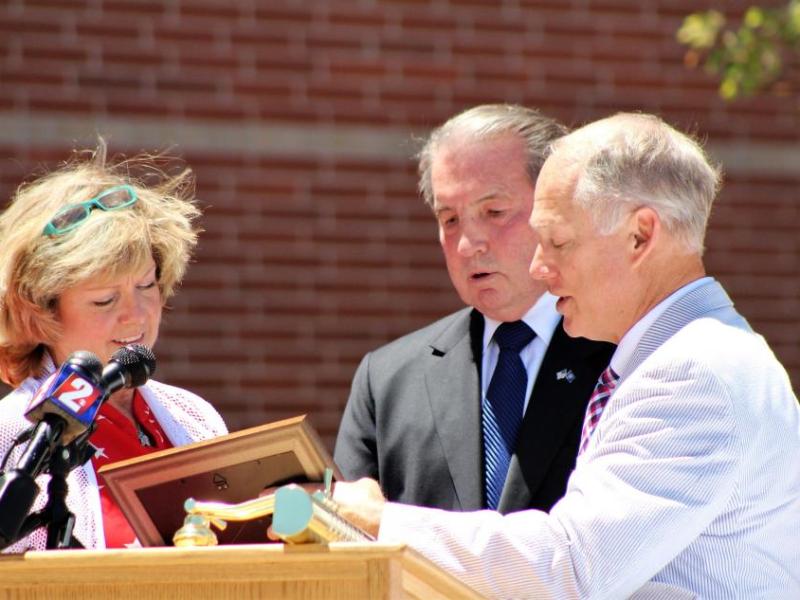 Photo by Brett Fisher. Carson City Mayor Bob Crowell accepts a dedication plaque from Foundation Forward founders.