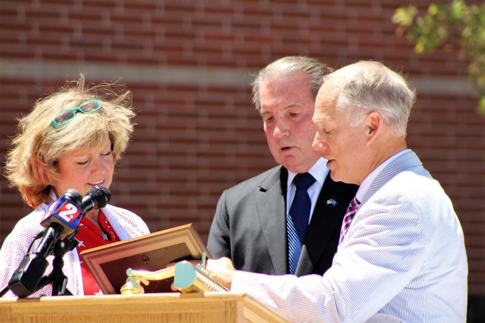 Photo by Brett Fisher. Carson City Mayor Bob Crowell accepts a dedication plaque from Foundation Forward founders.