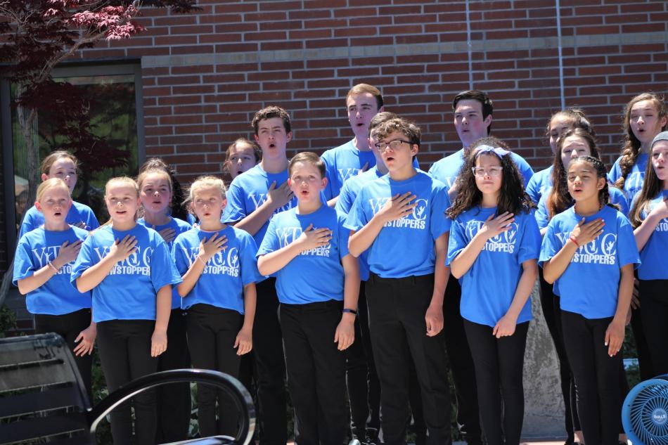 Youth Theater Carson City Showstoppers perform the National Anthem.