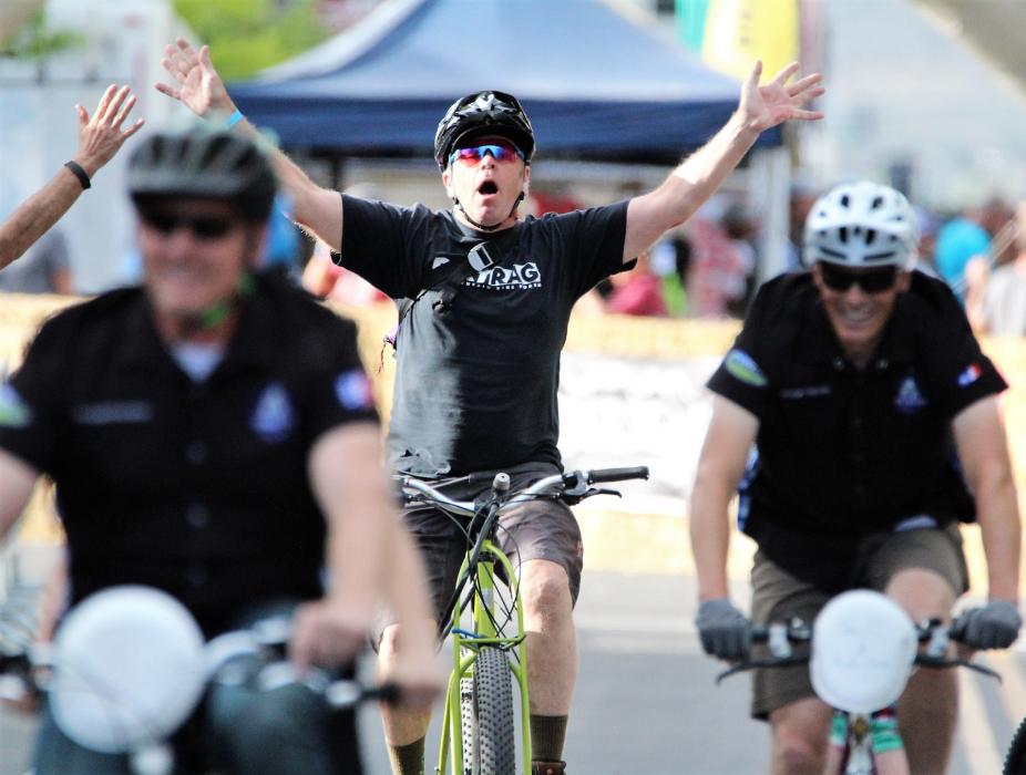 Photos by Brett Fisher. A Clunker Criterium rider finishes the two-lap race Friday.