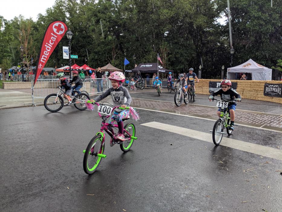 Rain couldn't stop kids and parents from cruising during The Kids Fun Ride