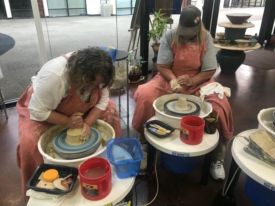 Instructors threw clay on the pottery wheel during the event.