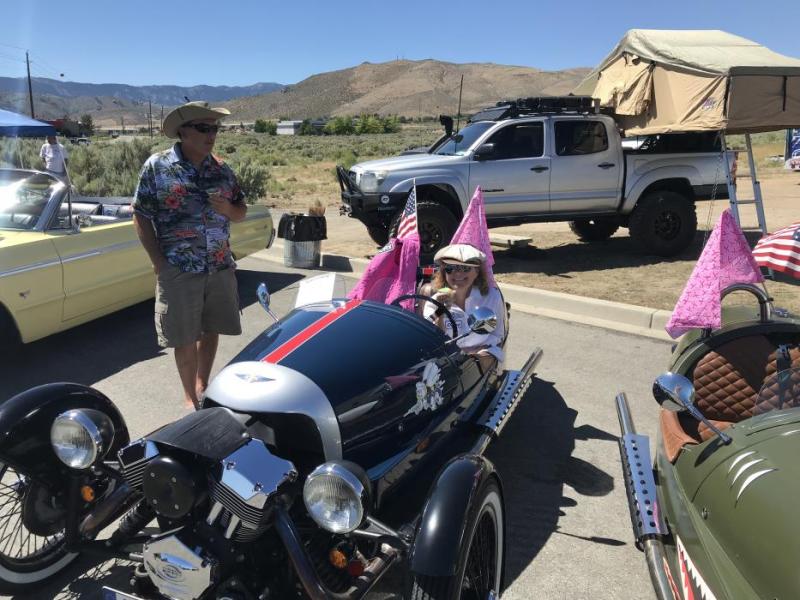 Diana Preston cools off behind her Morgan Three Wheeler.