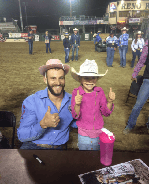 Trading hats for smiles at the Reno Rodeo on Wednesday night.