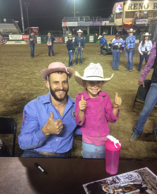 Trading hats for smiles at the Reno Rodeo on Wednesday night.