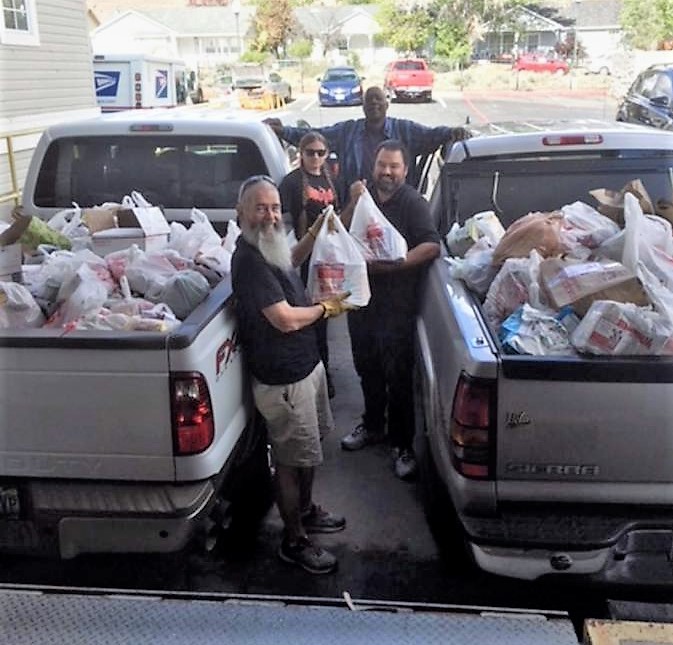 Volunteers Dick Goodrick, Ken Warren, Jesus Santos, and Caitlyn Goodfellow picked up more than 4,000 pounds of donated food.