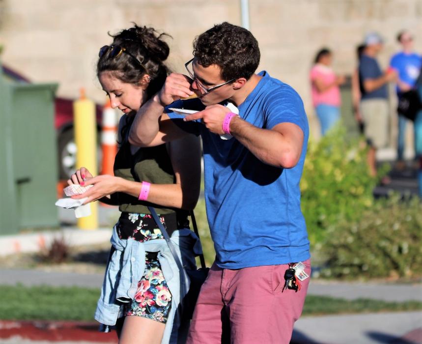 Photos by Brett Fisher. A couple enjoys the 2017 Taste of Downtown.