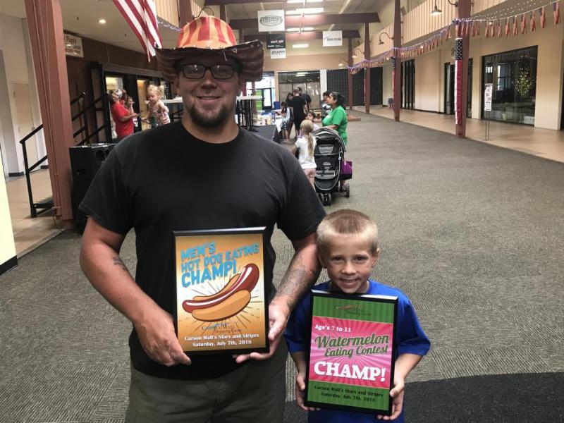 Father Casey Peterson and son Nick, 7, of Carson City each won their respective age groups in hot dog and watermelon eating.