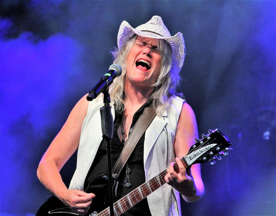 Photos by Brett Fisher. Cathy Richardson, lead vocalist for Jefferson Starship, belts out a chord Wednesday night at the BAC.