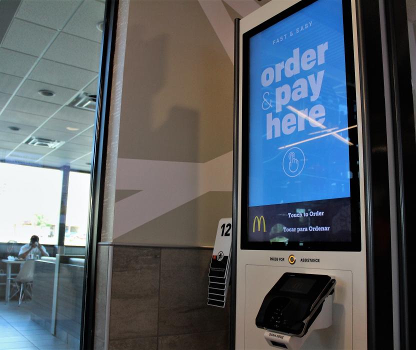 Digital kiosk near the order counter with Blue Tooth locators.