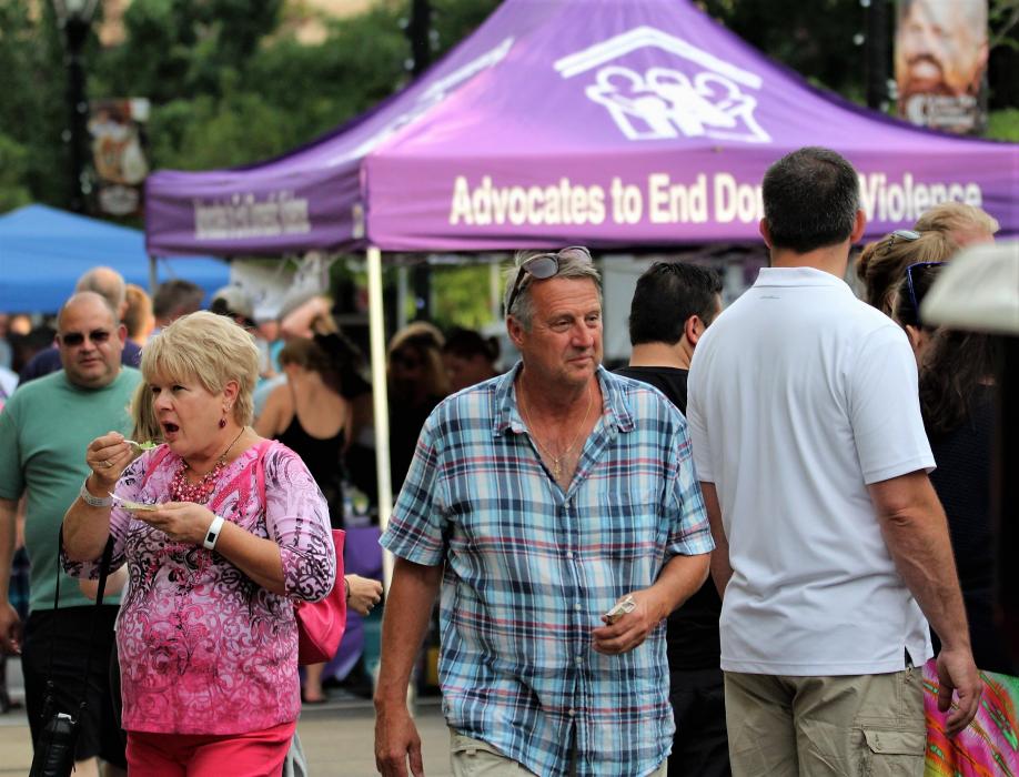 Tasters in front of the Advocates to End Domestic Violence booth.