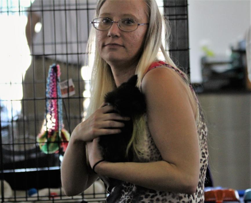 A woman holds a kitten Saturday during the adoption event at Michael Hohl Honda.