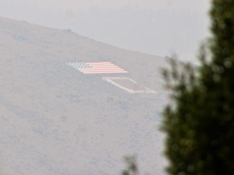 Photo by Brett Fisher. C Hill is partially obscured by smoke Sunday in Carson City.
