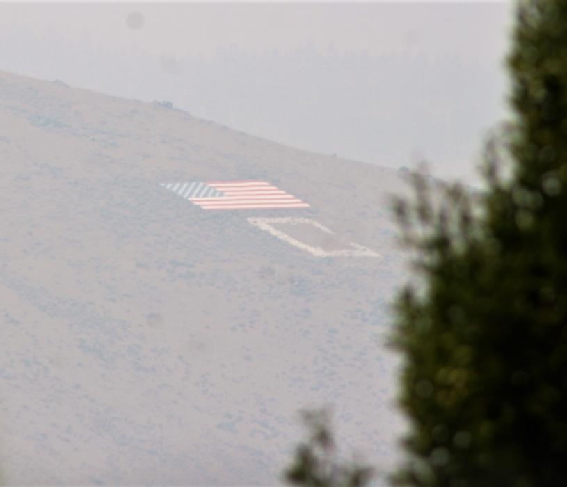 Photo by Brett Fisher. C Hill is partially obscured by smoke Sunday in Carson City.