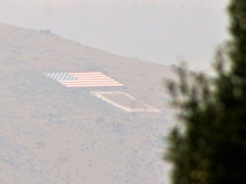 Photo by Brett Fisher. C Hill is partially obscured by smoke in the air.
