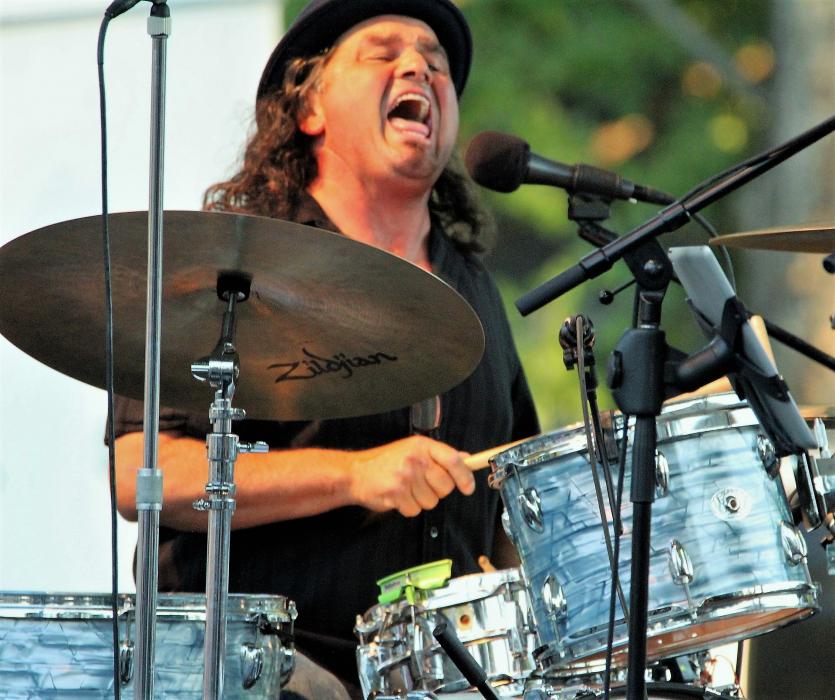 Photo by Brett Fisher. Drummer Mick Fecteau of the Trippin' King Snakes belts out a chord.