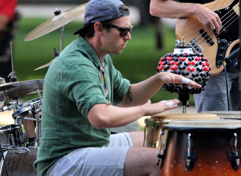 Bongo drum player with the No Comprende performs a solo Sunday.