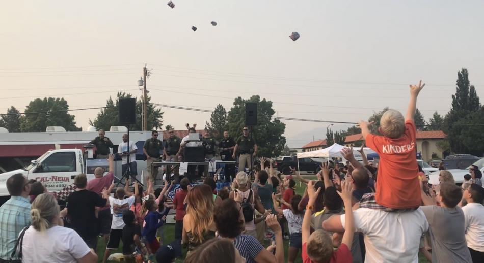 The crowd goes wild for T-Shirts and footballs thrown by Sheriff's Office members.