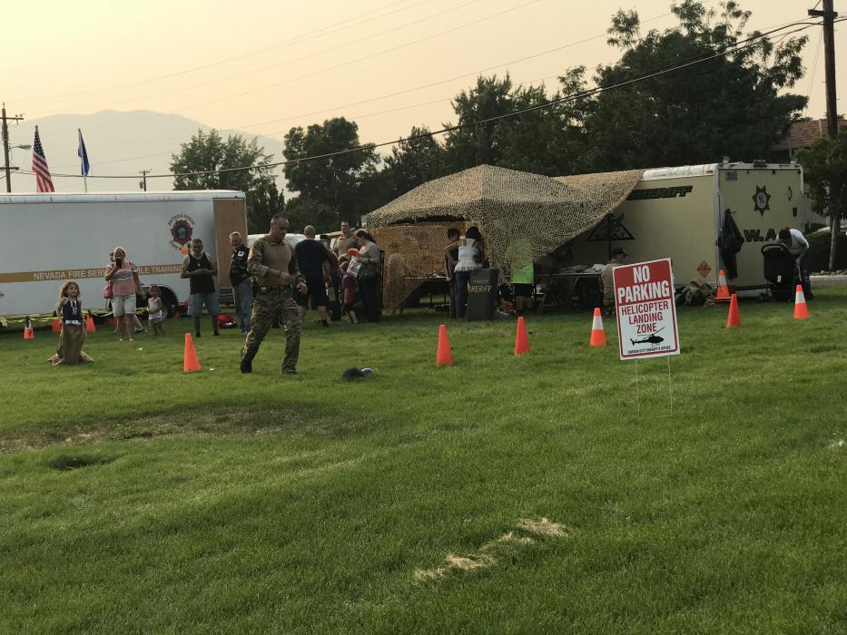 A tiny recruit is led through an obstacle course to get her ready for combat.