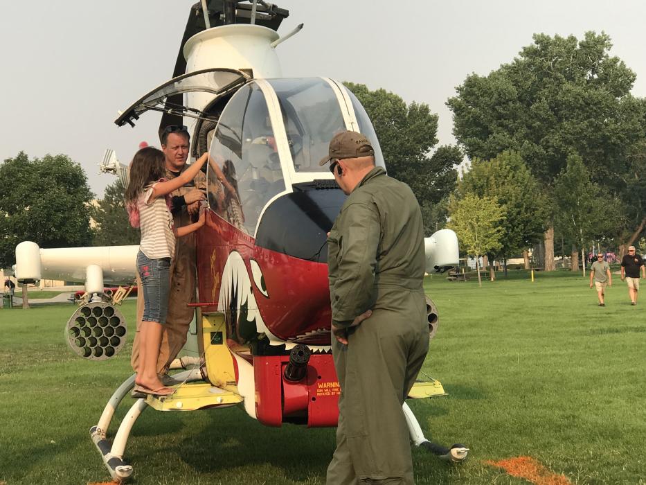 A helicopter enthusiast is given a tour.