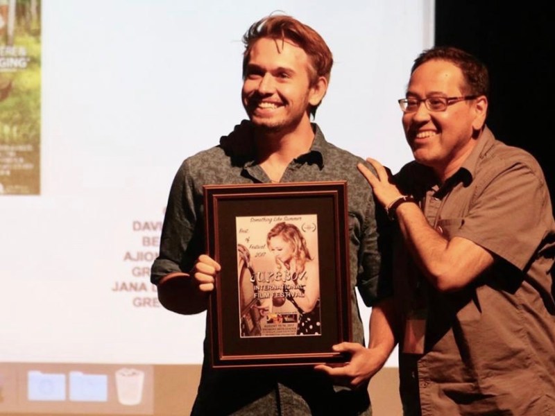 Photo by Angie Davis. Actor Grant Davis and writer-producer Carlos Pedraza accept an award at the 2017 JIFF.