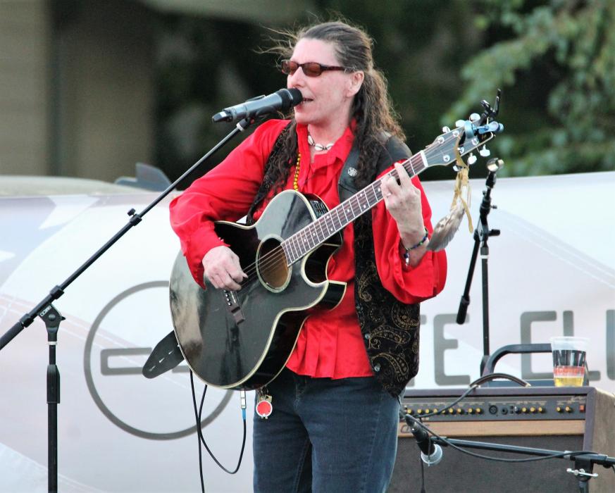 Local musician Canyon White performs during Festival of Heroes Saturday.