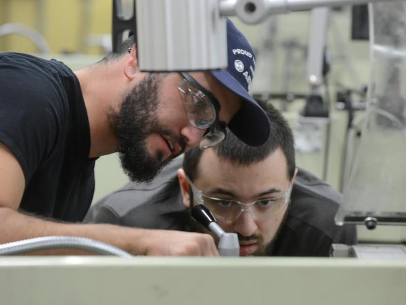 Humberto Vera, left, and John-Michael Juneau work in a machine tool class at Western Nevada College in Carson City.
