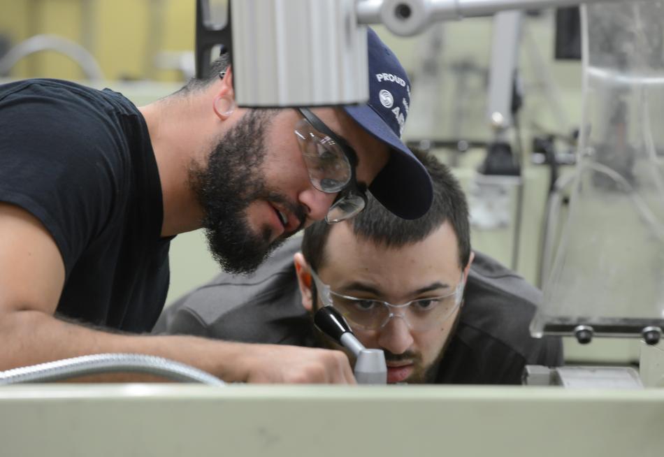 Humberto Vera, left, and John-Michael Juneau work in a machine tool class at Western Nevada College in Carson City.