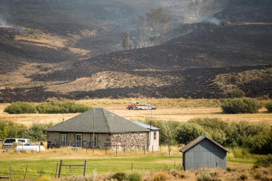 Engines in place to help protect a home on Maggie's Summit Road in the Sugarloaf Fire area. Forest Service photo