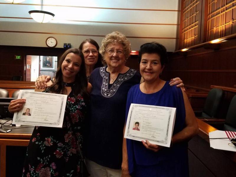 Florence Phillips, center with ESL grads who are now American citizens.