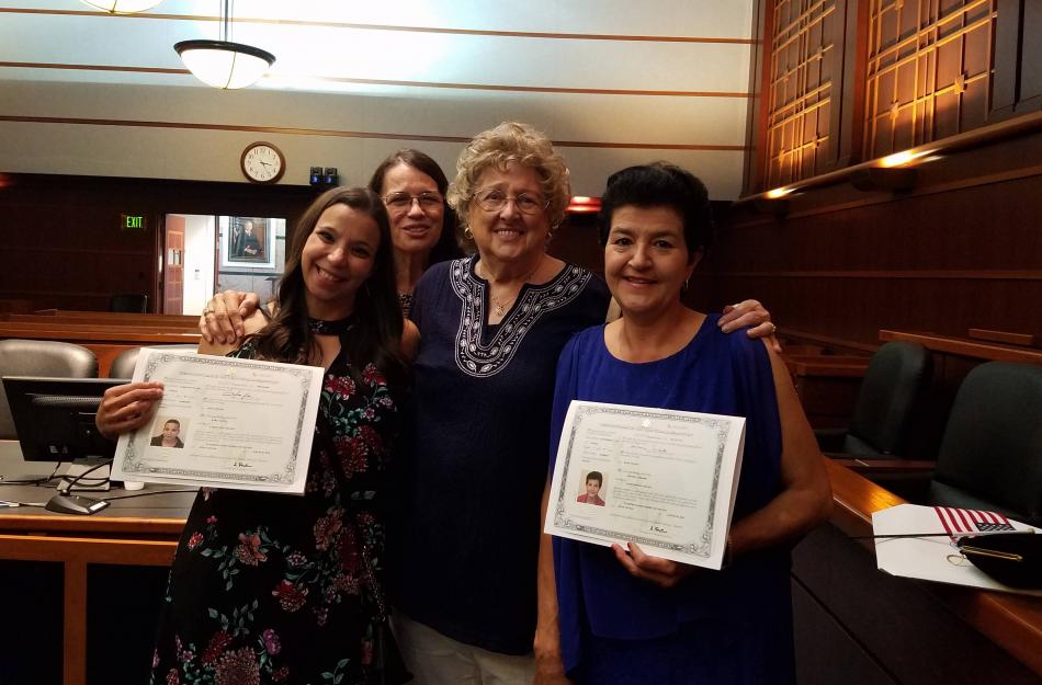 Florence Phillips, center with ESL grads who are now American citizens.