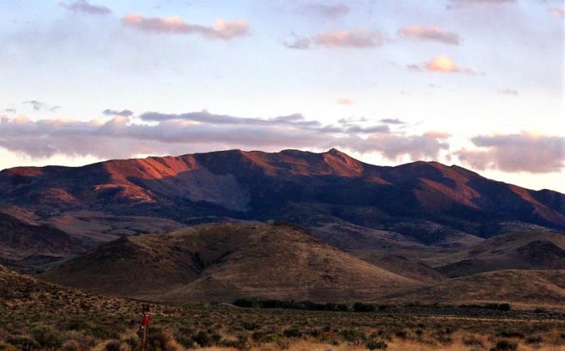 Photo by Brett Fisher. Rawe Peak, overlooking the Dayton Valley at sunset.