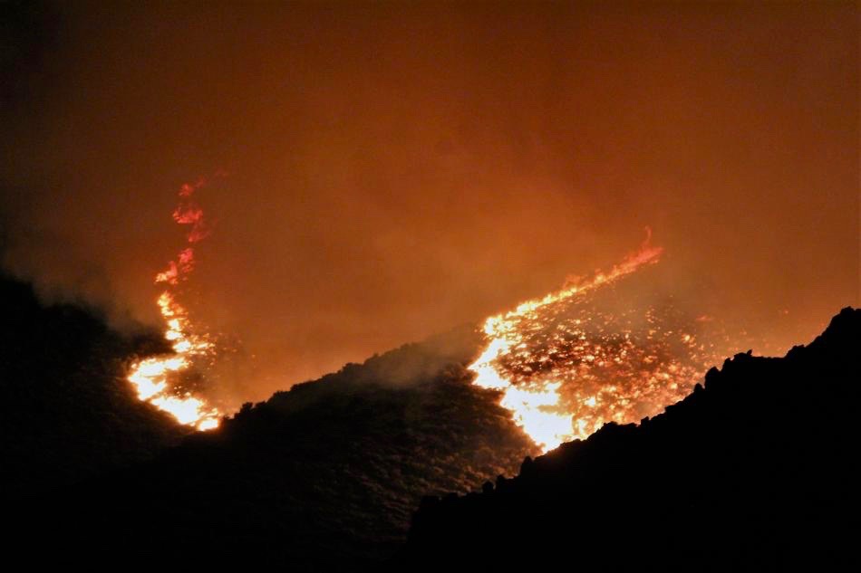 Photos by Brett Fisher. Eery glow of the Voltaire Fire in June 2018.
