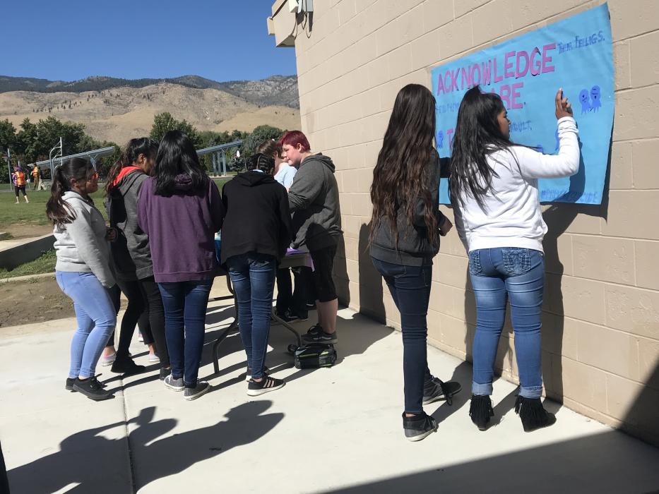 Students signed their names to a banner, and added badges to a Suicide Prevention pledge board.