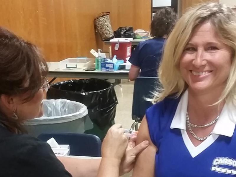 Sheila Story, CHS school nurse, getting her flu shot at a previous school-based flu vaccination clinic.