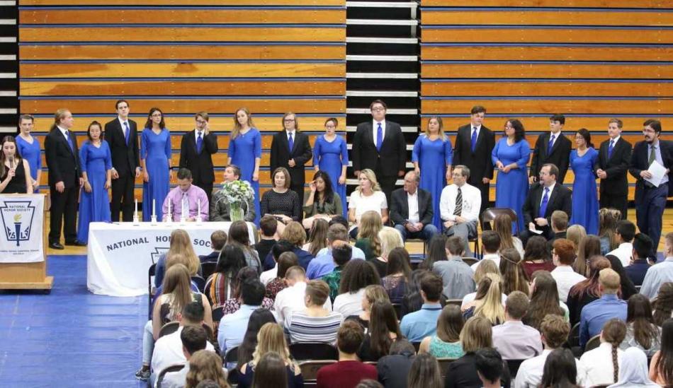 CHS National Honor Society president Eleeanor Sturm addressing the new members of NHS Sept. 17.