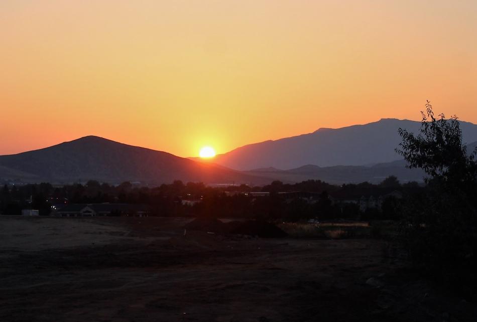 Photos by Brett Fisher. The sun begins to crest over the Pine Nut Range to the east of Carson City Saturday morning.