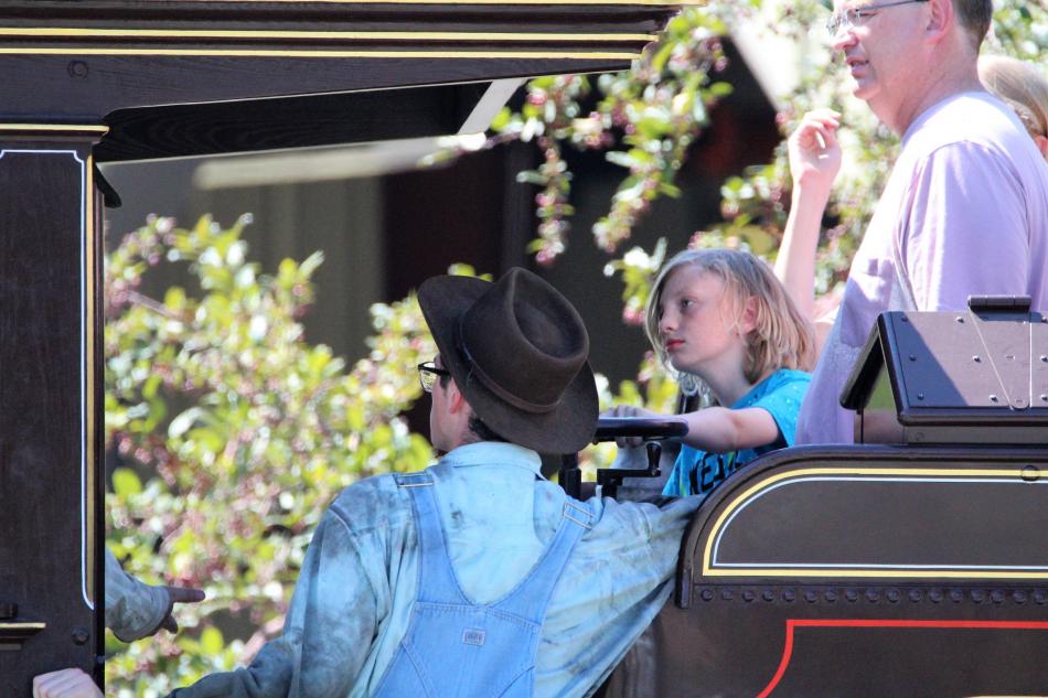 A family is given a steam demonstration aboard The 1875 Glennbrook Saturday.
