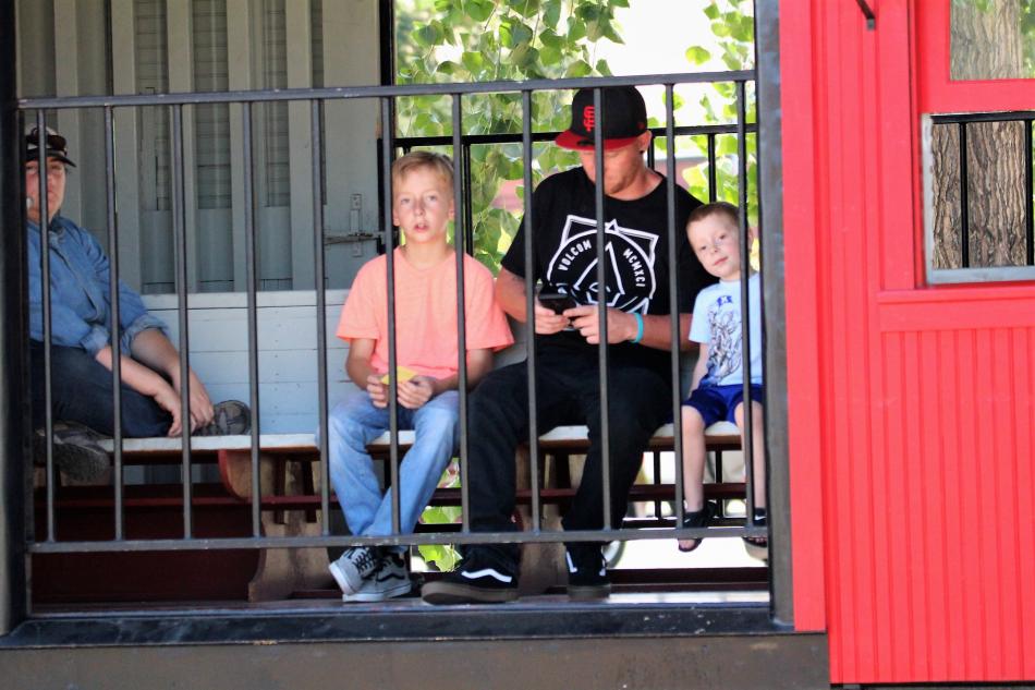 A family rides in the red caboose of the Virginia and Truckee Engine No. 25 Saturday.